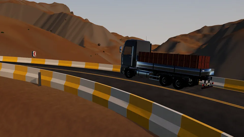 Loaded truck climbing a desert mountain road